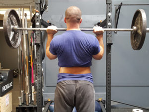 When elbows are set correctly, they will result in vertical forearms, as seen from behind.